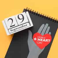 Free photo world heart day concept with notepad