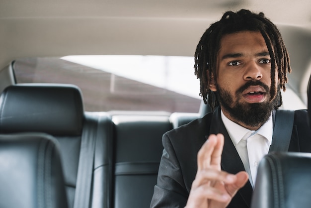 Worried afroamerican man in car