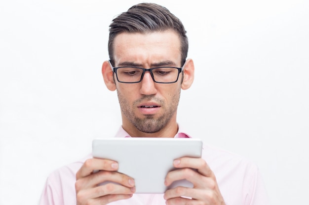 Free Photo worried handsome business man using tablet