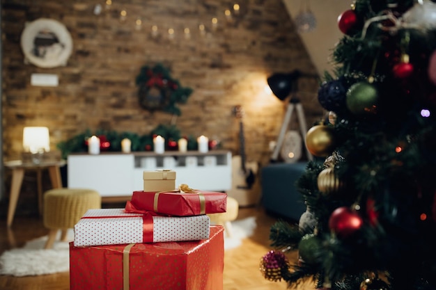 Wrapped gifts under the Christmas tree in the living room