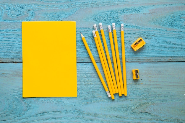 Free photo writing pencils laid near piece of paper