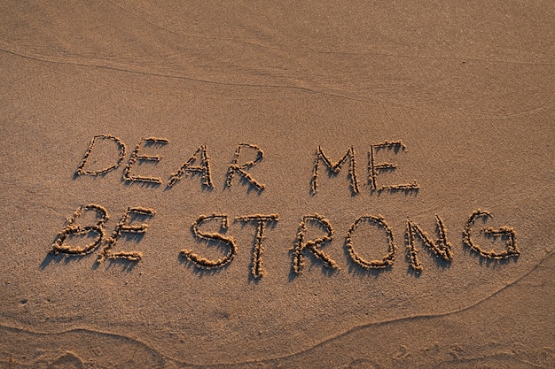 Free photo writing words in the sand