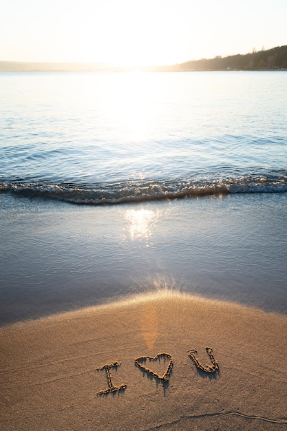 Free photo writing words in the sand