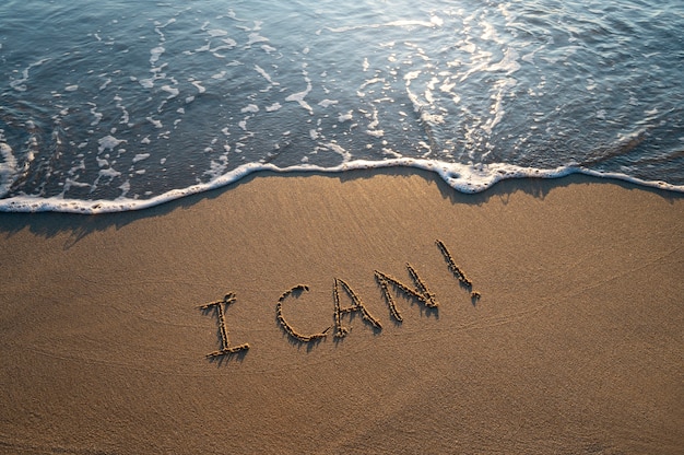 Free photo writing words in the sand