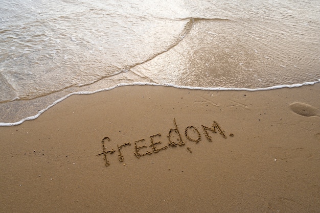 Free photo writing words in the sand