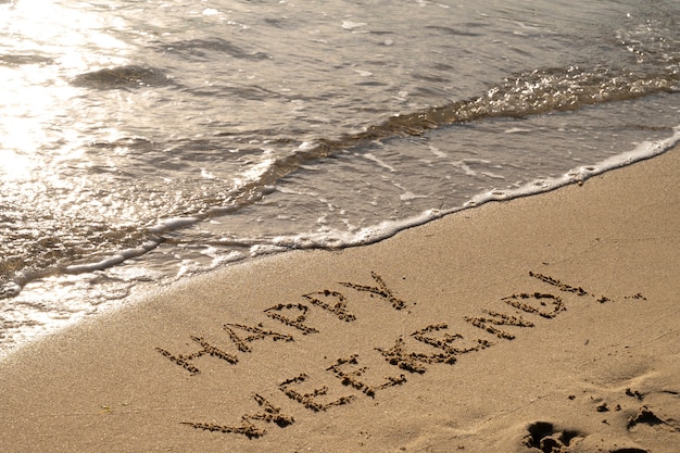 Free photo writing words in the sand