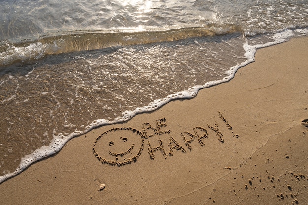 Free photo writing words in the sand