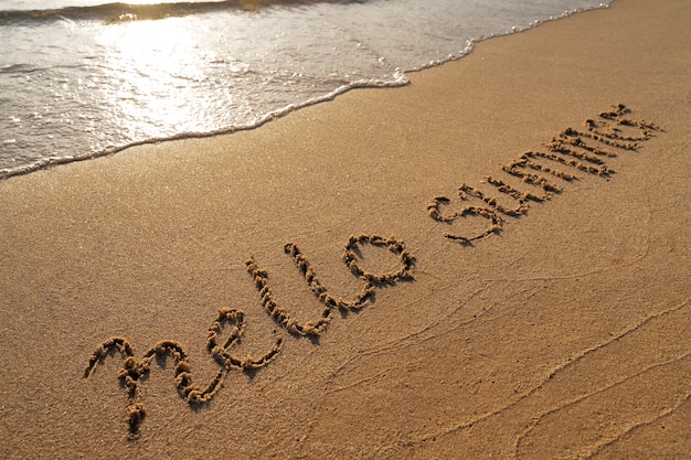 Free photo writing words in the sand