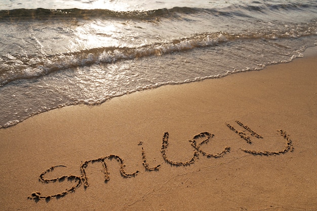 Free photo writing words in the sand