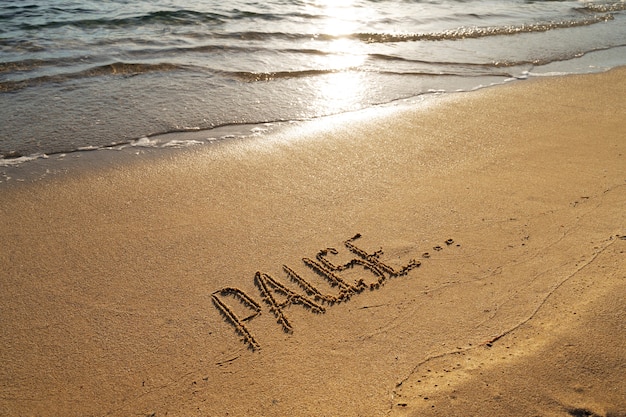 Free photo writing words in the sand