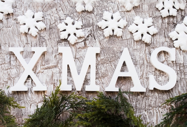 Free photo xmas inscription with snowflakes