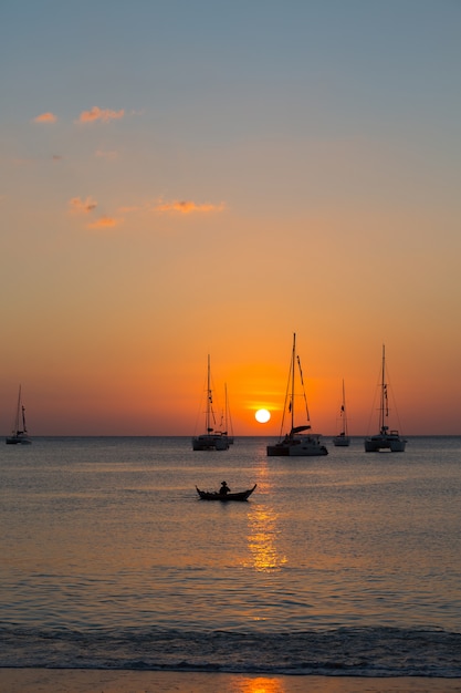 Free Photo yacht in the sea during sunset