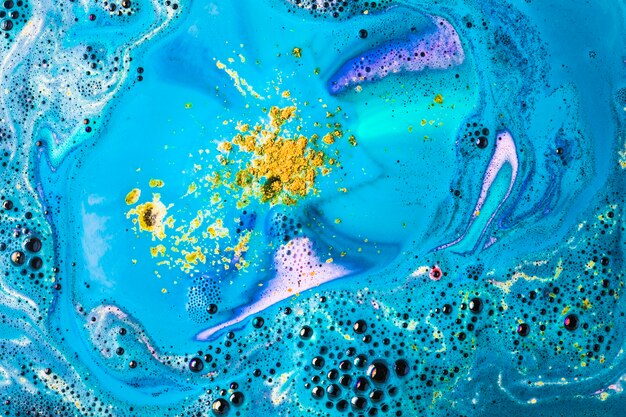 Yellow and blue bath bomb bubble dissolve backdrop