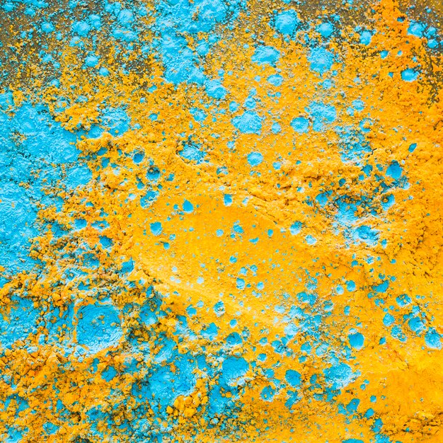 Yellow blue powder on table