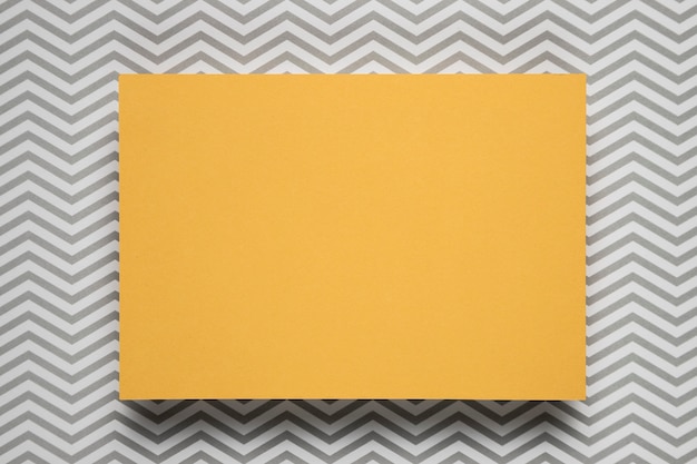 Free Photo yellow card with patterned background