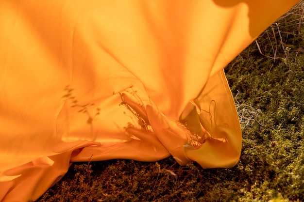 Free Photo yellow cloth lying in the fields