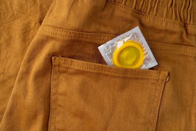 Free Photo yellow condom and jeans