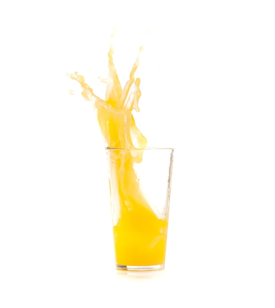 Free photo yellow drink falling in ice