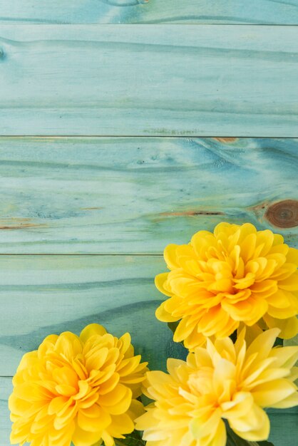 Yellow flowers on yellow tabletop