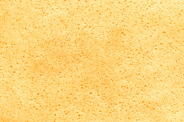 Free Photo yellow foam covering liquid