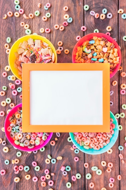 Free photo yellow frame on four bowls of cereals