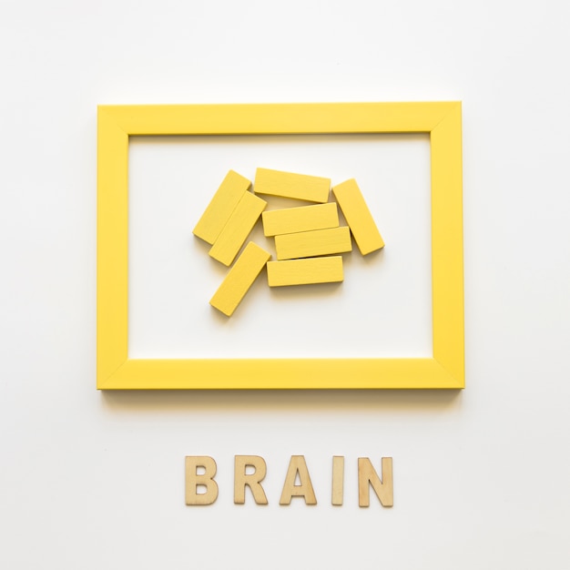 Yellow frame with wooden blocks near brain word