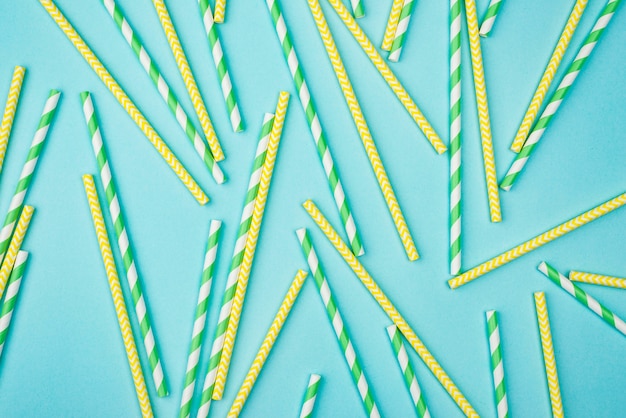 Free photo yellow and green with white stripes straws