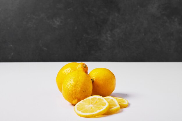 Yellow lemons on white.