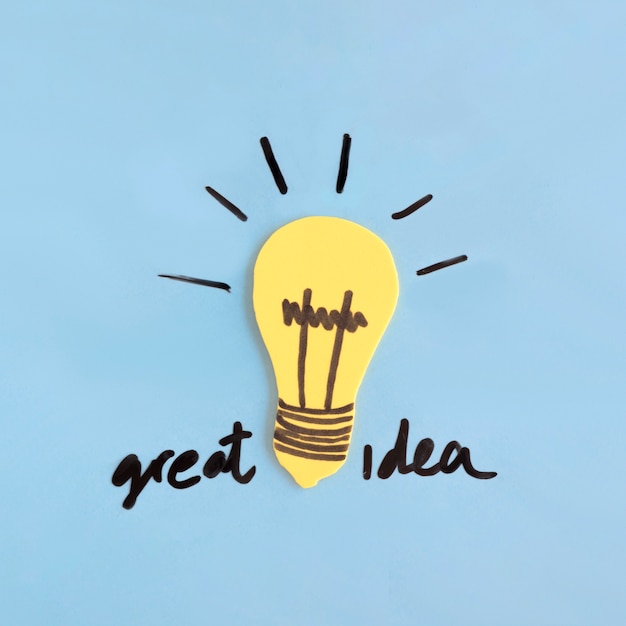 Yellow light bulb with great idea text on blue background