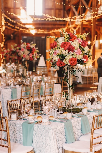 Free Photo yellow light garlands hang over the dinner tables decorated