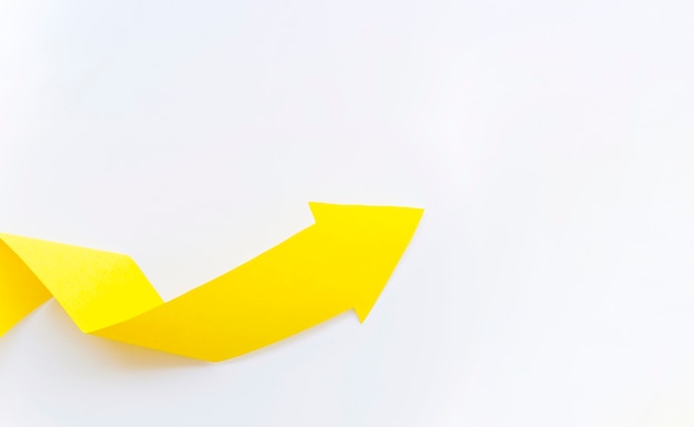 Yellow paper arrow with copy space