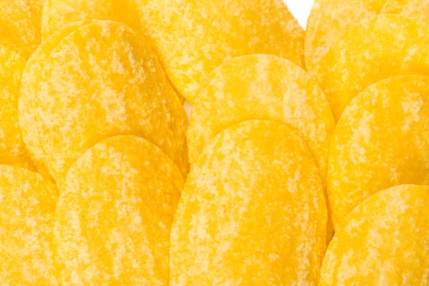 Yellow potato chips isolated on white