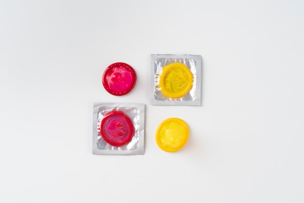 Free Photo yellow and red condoms arrangement top view