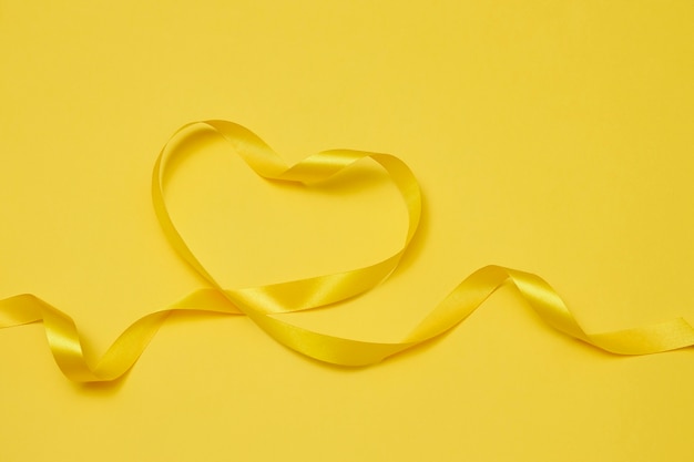 Yellow ribbon on yellowish background