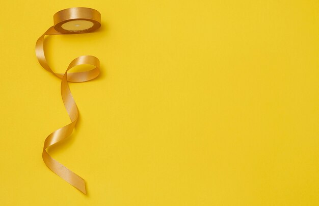 Yellow ribbon on yellowish background