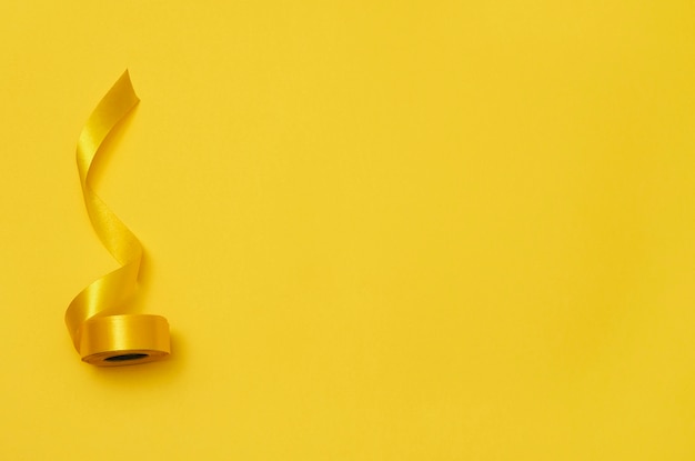 Yellow ribbon on yellowish background