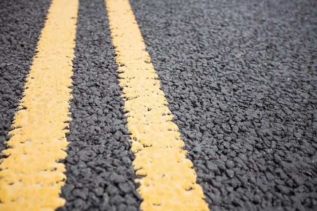 Yellow road marking on road surface