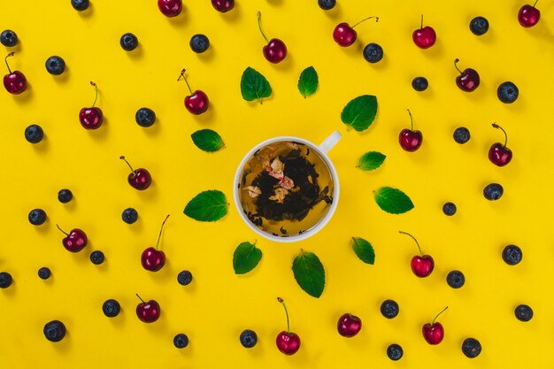 Yellow surface with summer fruits