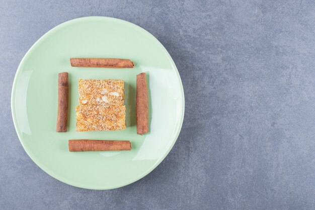 Yellow traditional turkish delight with peanuts and cinnabon.