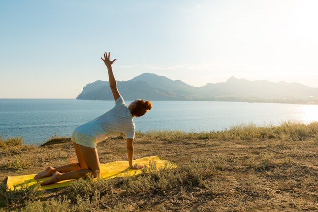 Yoga girl with wireless headphones