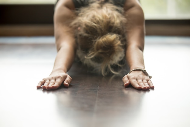 Free photo yoga at home: child pose