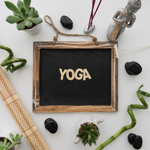 Free photo yoga lettering on chalkboard