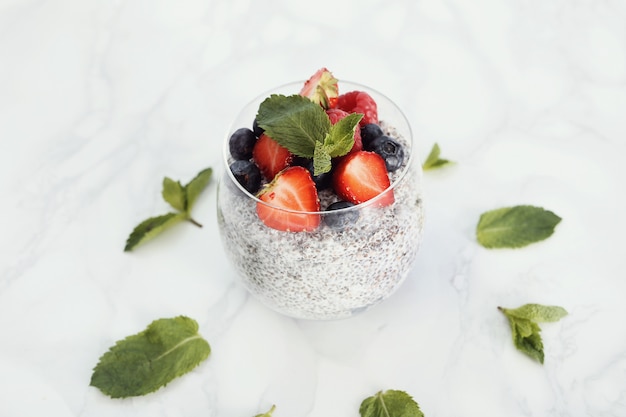 Yogurt with chia seed and berries in glass