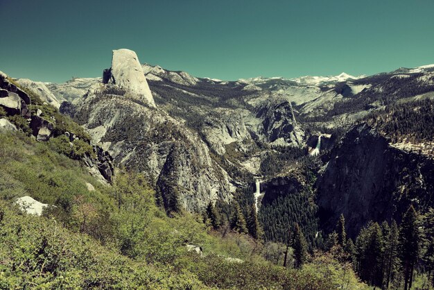 Yosemite mountain ridge with waterfall.