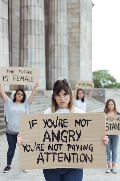 Free photo young activists marching together for change