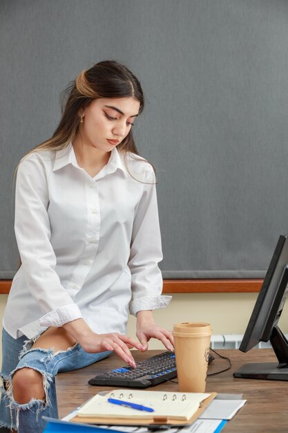 Young adorable girl working at the office High quality photo