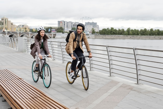 Young adult cycling to work in the city