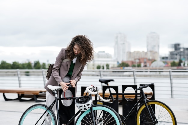 Young adult cycling to work in the city