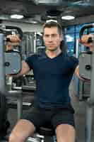 Free photo young adult doing indoor sport at the gym