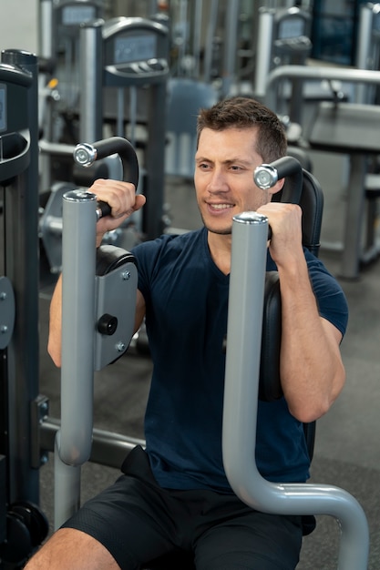 Young adult doing indoor sport at the gym